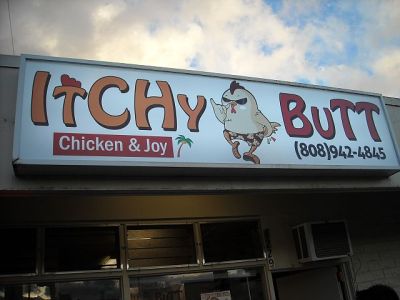 Notice the chicken on the sign is scratching his rear while giving the "shaka" (hang loose) symbol.